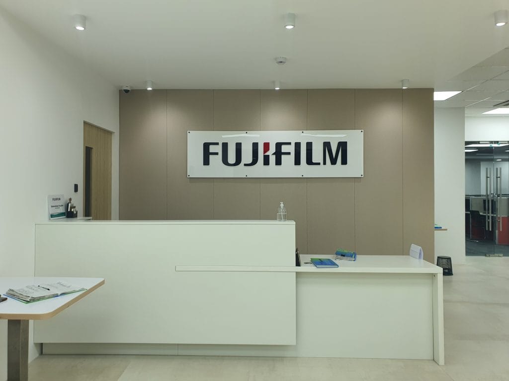 Completed modern reception desk area and office interior fit-out for Fujifilm in BGC Taguig