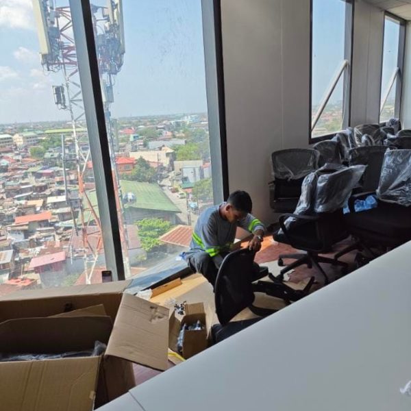 SDSI team assembling office furniture and workstations for a commercial fit-out project