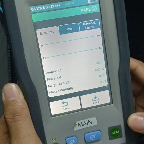 Technician using a network cable certifier device to test connection performance