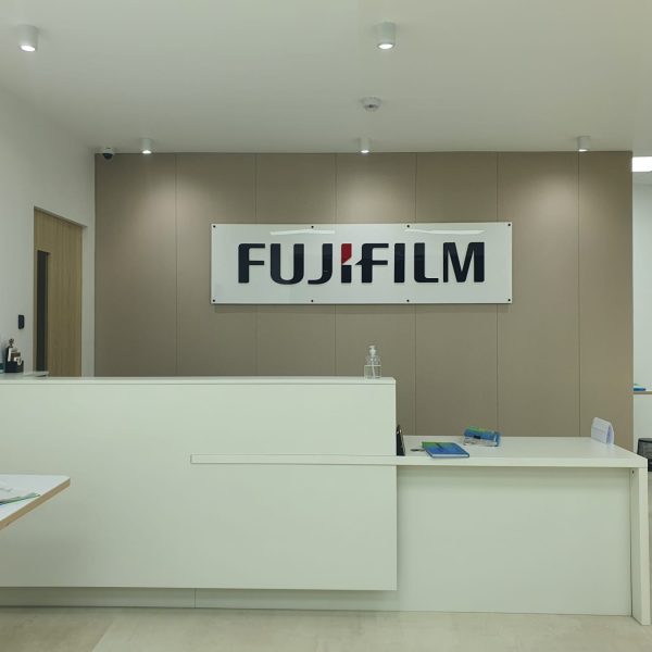 Completed modern reception desk area and office interior fit-out for Fujifilm in BGC Taguig
